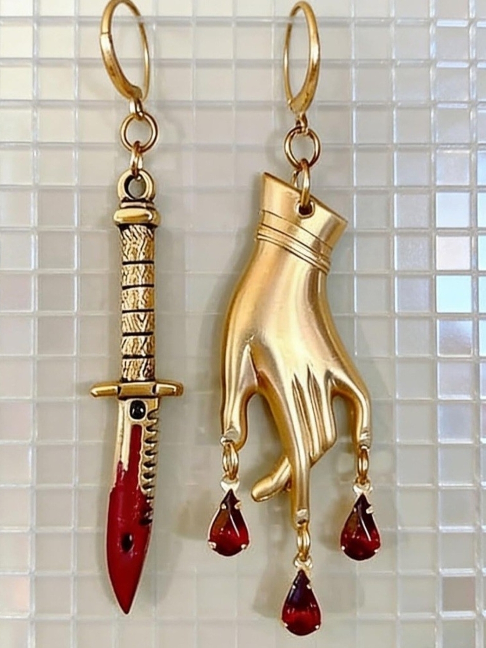 Gold Hand and Dagger Asymmetrical Earrings with Red Gem Drops